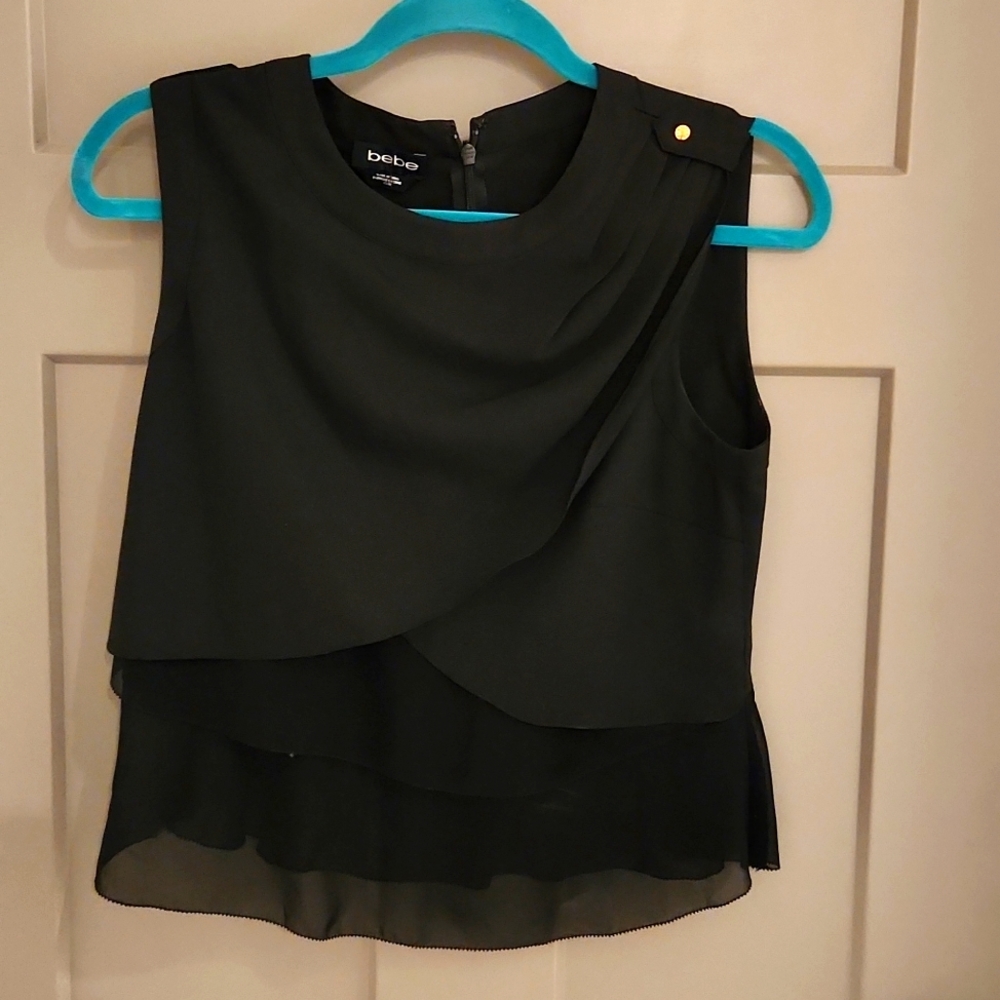 NEW BEBE black blouse . NEW Must see